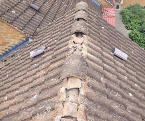 This is a photo if a roof ridge which has missing tiles. The ridge tiles are being replaced by DSC Roofing Rushden